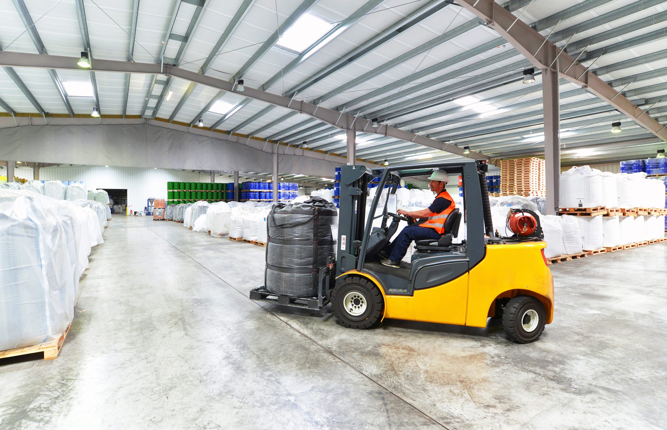 Man driving a forklift in a warehouse
