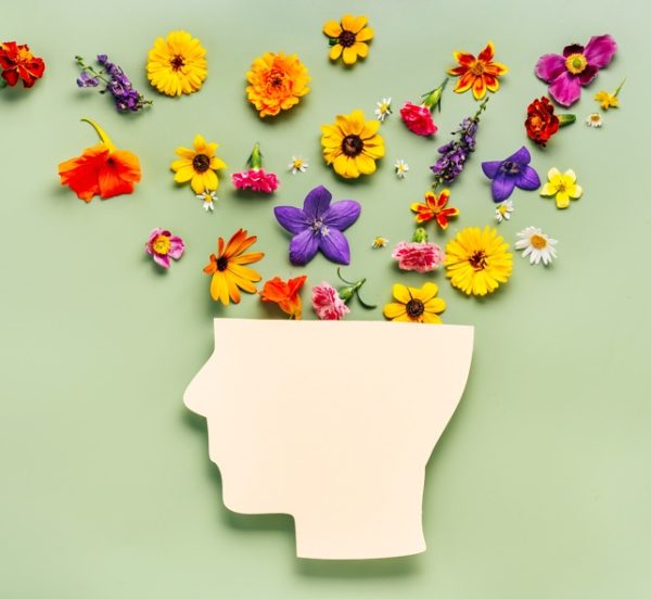 Human head with flowers coming out of it
