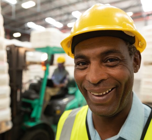 male worker smiling at a warehouse